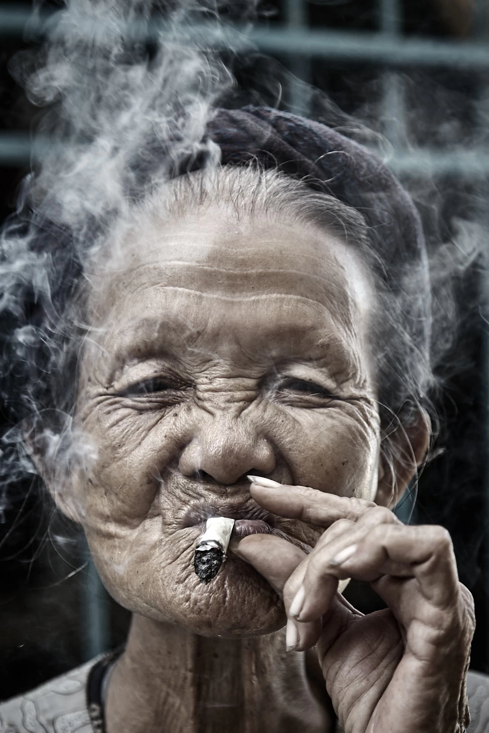 Old Vietnamese woman smoking
