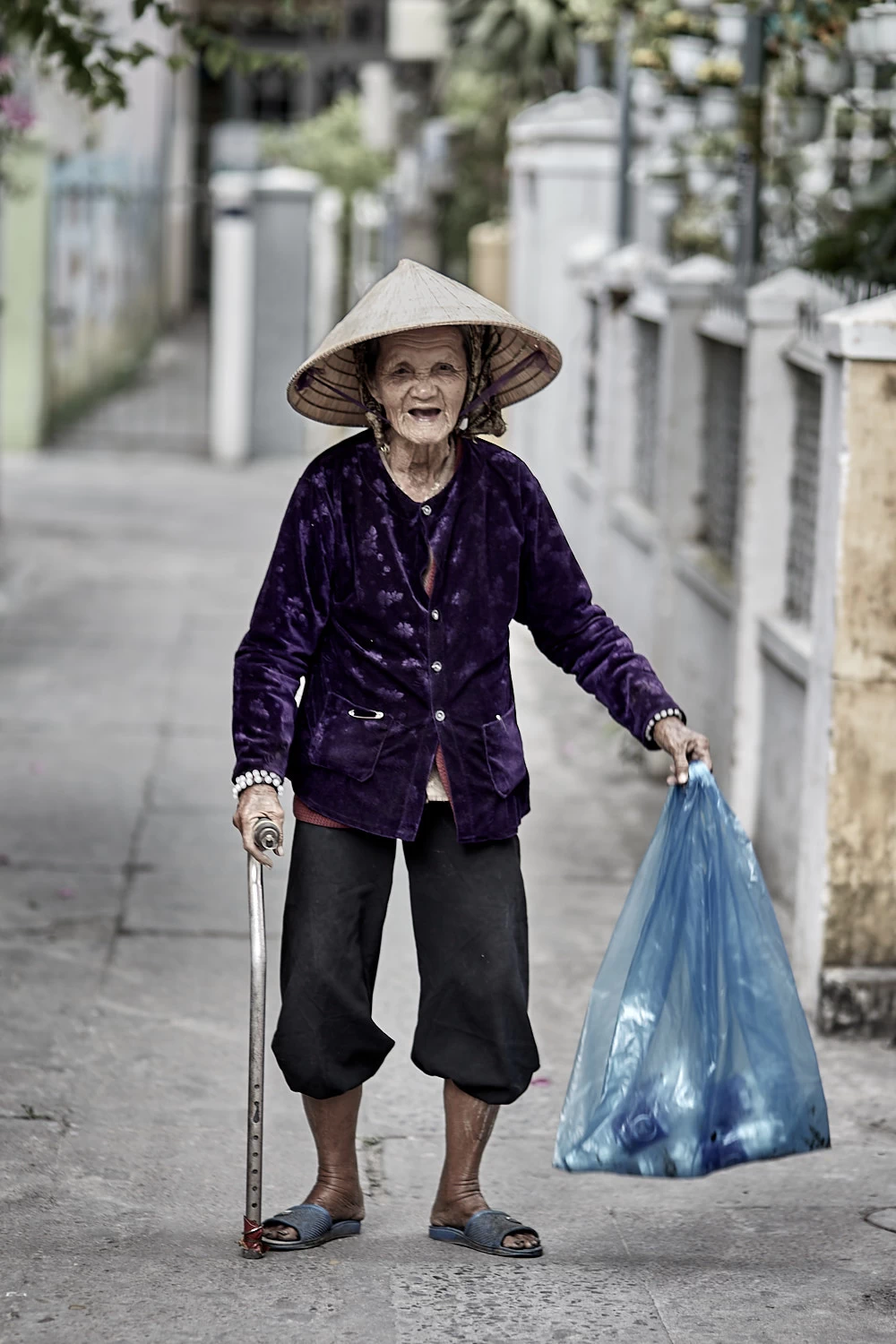 Vietnamese woman with walking cane
