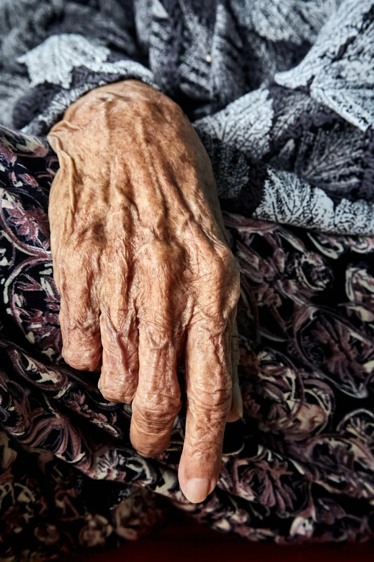 Hands of an old Vietnamese woman