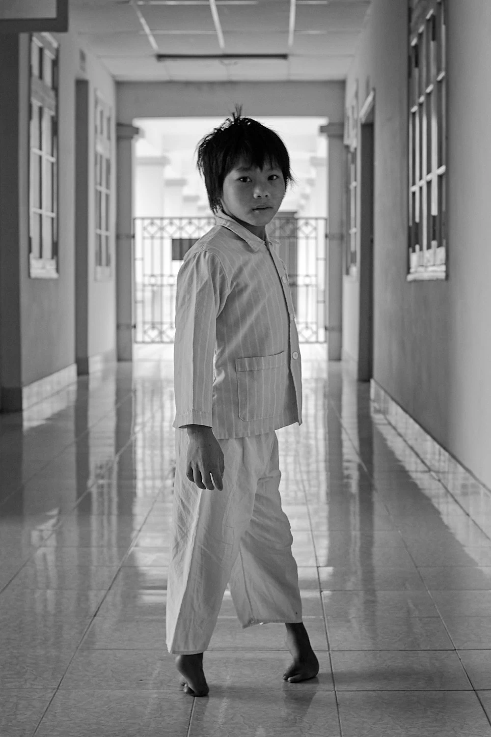 Boy with deformed feet, in Vietnam