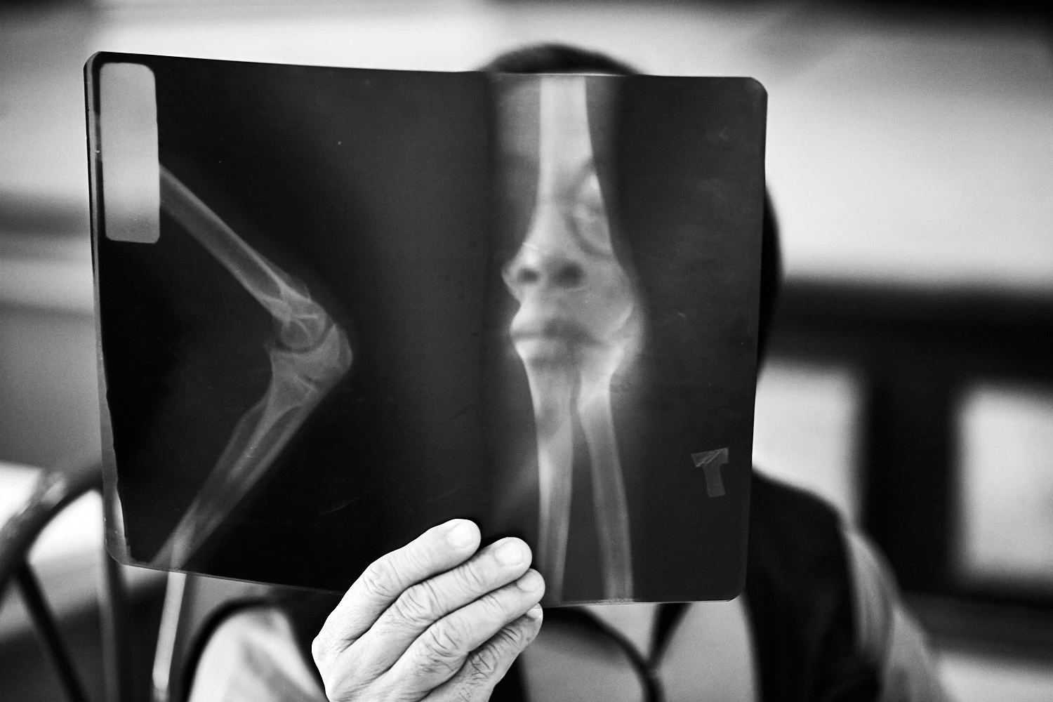 Vietnamese doctor looking at X-rays