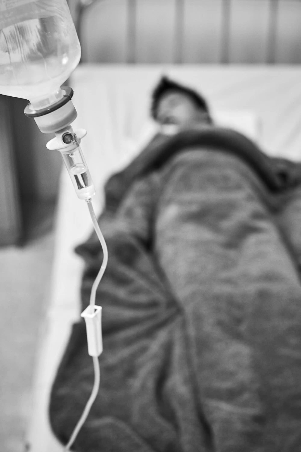 Child on a drip in recovery room in Vietnamese hospital