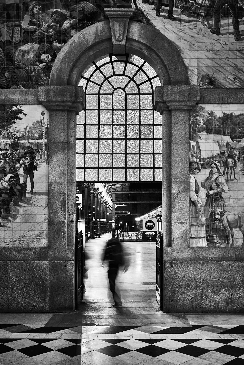 Blurry man entering platform Sao Bento railway station, Porto
