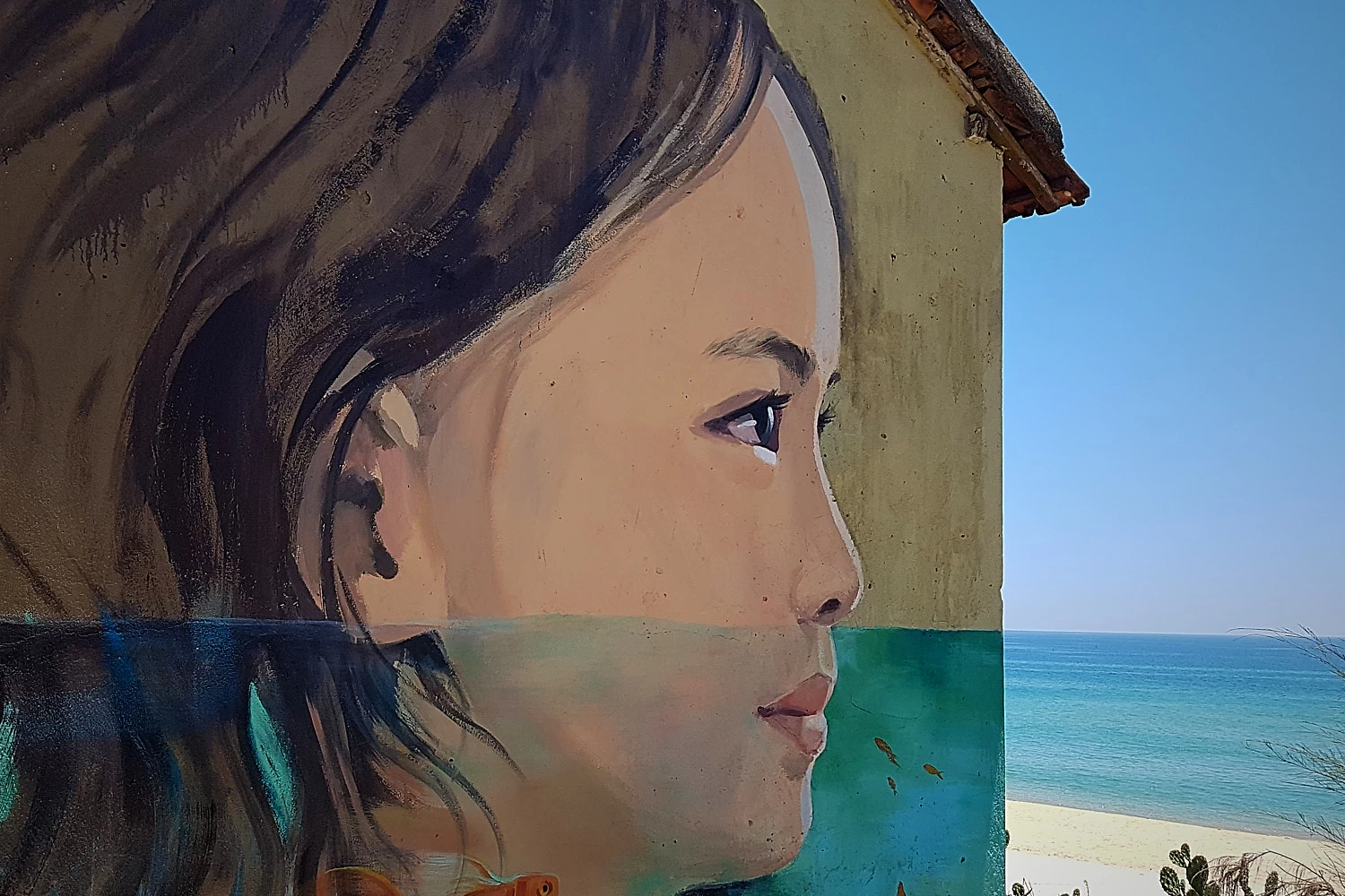 In a Vietnamese village the sea in a painting lines up with the real sea