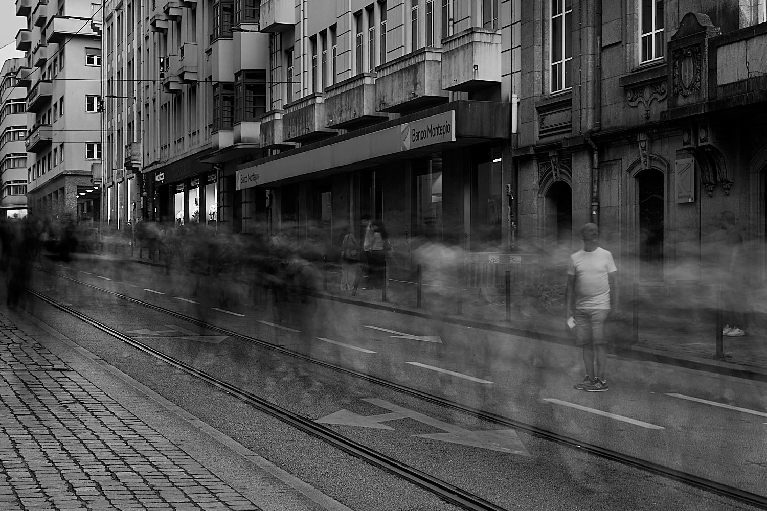 Blurry crowd in porto, where only one man stands apart.