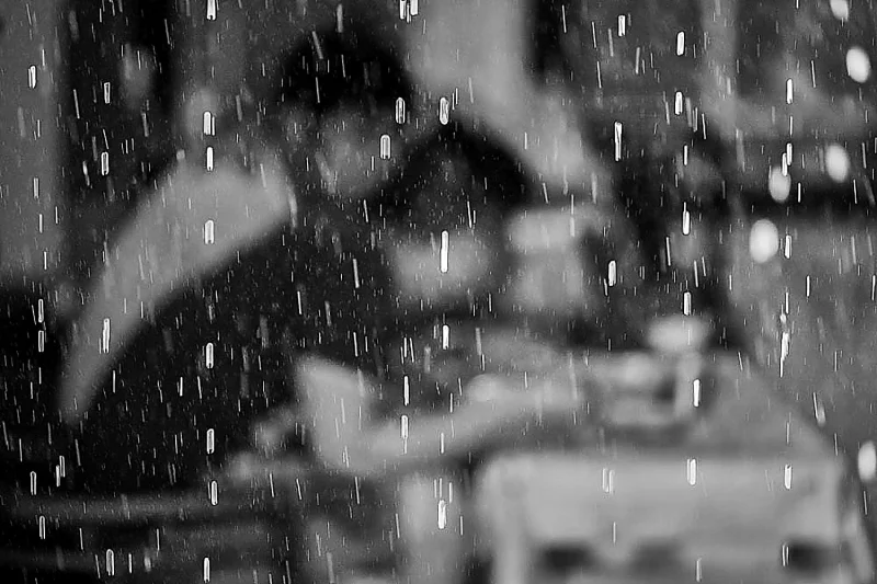 Having breakfast behind a curtain of rain, in Vietnam